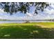 Lush backyard with a private dock and boathouse on a tranquil lake at 254 Lake Tennessee Dr, Auburndale, FL 33823