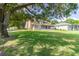 Expansive backyard with lush greenery, showcasing the home's tranquil setting and outdoor space at 254 Lake Tennessee Dr, Auburndale, FL 33823