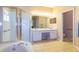 The bathroom features a glass shower, double sink vanity, and a large soaking tub at 254 Lake Tennessee Dr, Auburndale, FL 33823