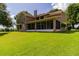 Spacious home exterior with a large, screened-in porch perfect for relaxing at 254 Lake Tennessee Dr, Auburndale, FL 33823