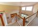 Open foyer featuring high ceilings, a staircase with white railings, and views of the living spaces below at 254 Lake Tennessee Dr, Auburndale, FL 33823
