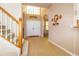 Grand foyer featuring soaring ceilings, natural light, and a staircase at 254 Lake Tennessee Dr, Auburndale, FL 33823