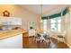 Eat-in kitchen area features a round table next to large window for abundant natural light at 254 Lake Tennessee Dr, Auburndale, FL 33823