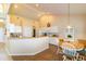 Spacious kitchen and dining area with white cabinets, an island, and ample natural light at 254 Lake Tennessee Dr, Auburndale, FL 33823