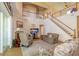 The living room is equipped with a fireplace, stairs, and a view of the open floorplan at 254 Lake Tennessee Dr, Auburndale, FL 33823