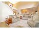 Open living room view with staircase and an easy flow to the kitchen provides an inviting atmosphere at 254 Lake Tennessee Dr, Auburndale, FL 33823