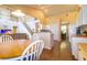 Open-concept living space featuring a kitchen, dining area, staircase, and views throughout the home at 254 Lake Tennessee Dr, Auburndale, FL 33823