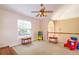 Cozy loft area, perfect as a playroom with natural lighting from the window at 254 Lake Tennessee Dr, Auburndale, FL 33823
