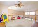Spacious loft with vaulted ceilings and natural light, great for a playroom at 254 Lake Tennessee Dr, Auburndale, FL 33823
