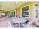 Inviting outdoor dining area on a covered patio, perfect for entertaining guests at 254 Lake Tennessee Dr, Auburndale, FL 33823