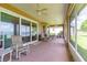 Spacious screened-in patio with comfortable seating and picturesque lake views at 254 Lake Tennessee Dr, Auburndale, FL 33823