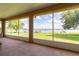 Relaxing screened-in patio offering expansive views of the serene lake and backyard at 254 Lake Tennessee Dr, Auburndale, FL 33823
