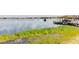 Scenic waterfront view with a dock, gazebo, and boat, perfect for enjoying lakeside living at 254 Lake Tennessee Dr, Auburndale, FL 33823