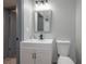 Renovated bathroom featuring modern vanity, mirror, and toilet at 315 Eastway Dr, Lakeland, FL 33803