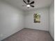 Cozy bedroom featuring plush carpeting, neutral paint, and a ceiling fan at 315 Eastway Dr, Lakeland, FL 33803