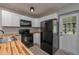 Bright kitchen with new butcher block countertops and stainless steel appliances at 315 Eastway Dr, Lakeland, FL 33803