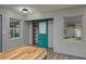 Bright room with fresh paint, modern lighting, and access to the closet and outside at 315 Eastway Dr, Lakeland, FL 33803