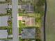 An aerial view of a beautiful home, showcasing a well-maintained roof, yard, and neighborhood at 3341 Highland Fairways Blvd, Lakeland, FL 33810