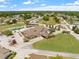 Panoramic aerial shot features the community, its clubhouse, and the surrounding green landscape at 3341 Highland Fairways Blvd, Lakeland, FL 33810