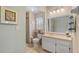 Bright bathroom with vanity, mirror, updated fixtures, and linen closet at 3341 Highland Fairways Blvd, Lakeland, FL 33810