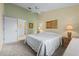 This bedroom has neutral carpet, ceiling fan, ensuite access, and calming wall colors at 3341 Highland Fairways Blvd, Lakeland, FL 33810