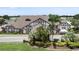 A view of the clubhouse and surrounding greenery that add to the overall curb appeal at 3341 Highland Fairways Blvd, Lakeland, FL 33810