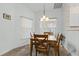 Cozy dining area featuring natural lighting, a wooden table set, and a view to the yard at 3341 Highland Fairways Blvd, Lakeland, FL 33810