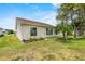 This charming home offers a well-manicured lawn with updated landscaping and a bright exterior at 3341 Highland Fairways Blvd, Lakeland, FL 33810