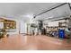 Spacious garage with ample lighting, work bench, storage, and garage door opener at 3341 Highland Fairways Blvd, Lakeland, FL 33810