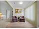 Inviting living room with hardwood floors, natural light, and comfortable plaid armchairs at 3341 Highland Fairways Blvd, Lakeland, FL 33810