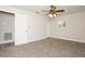 Cozy bedroom featuring plush carpet, a ceiling fan, and a large closet for ample storage at 4008 S Carlisle Rd, Lakeland, FL 33813