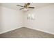 Bedroom featuring neutral carpet and a window with plantation shutters for natural light at 4008 S Carlisle Rd, Lakeland, FL 33813
