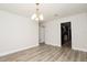 Dining room features hardwood floors and modern chandelier at 4008 S Carlisle Rd, Lakeland, FL 33813