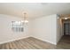 Well-lit dining room with modern flooring and a decorative chandelier at 4008 S Carlisle Rd, Lakeland, FL 33813