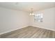 Bright dining room with updated flooring and a classic chandelier at 4008 S Carlisle Rd, Lakeland, FL 33813