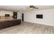 Kitchen and living area featuring hardwood floors and modern appliances at 4008 S Carlisle Rd, Lakeland, FL 33813