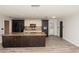Spacious kitchen with a large island, modern appliances, and two-tone cabinetry at 4008 S Carlisle Rd, Lakeland, FL 33813