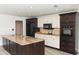 Modern kitchen with granite countertops, stainless steel appliances, and custom cabinets at 4008 S Carlisle Rd, Lakeland, FL 33813