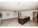 Spacious living room features hardwood floors, two windows, and neutral wall color at 4008 S Carlisle Rd, Lakeland, FL 33813