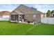Nice backyard with screened patio, brick area with grill and furniture; ideal for entertaining and relaxation at 4041 Byrds Crossing Dr, Lakeland, FL 33812