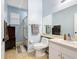 Comfortable bathroom with walk-in shower, vanity, and toilet, accented with soft blue walls at 4041 Byrds Crossing Dr, Lakeland, FL 33812