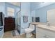 This bathroom offers a shower-tub combo, tile floors, a dresser and a large mirror at 4041 Byrds Crossing Dr, Lakeland, FL 33812
