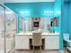 Bright bathroom features a double vanity, mirrors, a walk-in shower, and a toilet at 4041 Byrds Crossing Dr, Lakeland, FL 33812