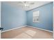 This bedroom is painted light blue and offers a window with blinds at 4041 Byrds Crossing Dr, Lakeland, FL 33812