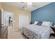 This bedroom offers a ceiling fan, closet and an entrance to the walk-in closet at 4041 Byrds Crossing Dr, Lakeland, FL 33812
