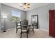 Bright dining area features a round table, chairs, a window, and a ceiling fan at 4041 Byrds Crossing Dr, Lakeland, FL 33812