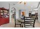 Dining area with a round table and chairs adjacent to a reading room and kitchen area at 4041 Byrds Crossing Dr, Lakeland, FL 33812