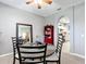 A dining room with round table, chairs and view of the bright kitchen at 4041 Byrds Crossing Dr, Lakeland, FL 33812