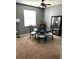 Dining room with a round table set, with a large mirror and window, ideal for intimate gatherings at 4041 Byrds Crossing Dr, Lakeland, FL 33812