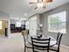 Open-concept dining area adjacent to the living room with lots of natural light at 4041 Byrds Crossing Dr, Lakeland, FL 33812